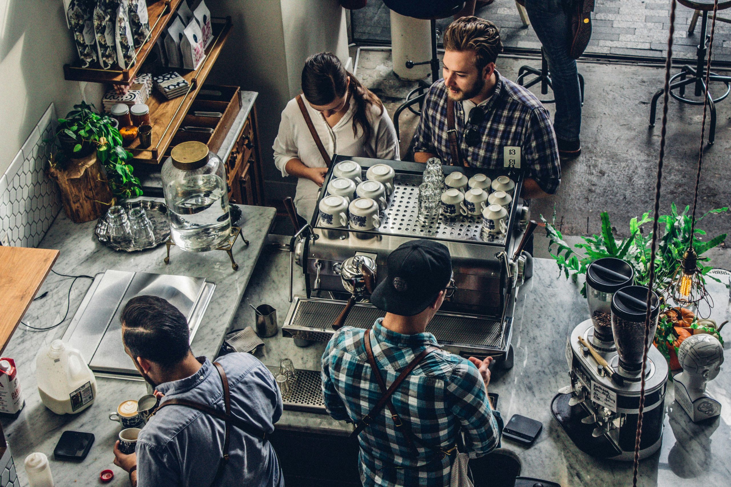 Customers at a coffee shop counter. Photo by Joshua Rodriguez.